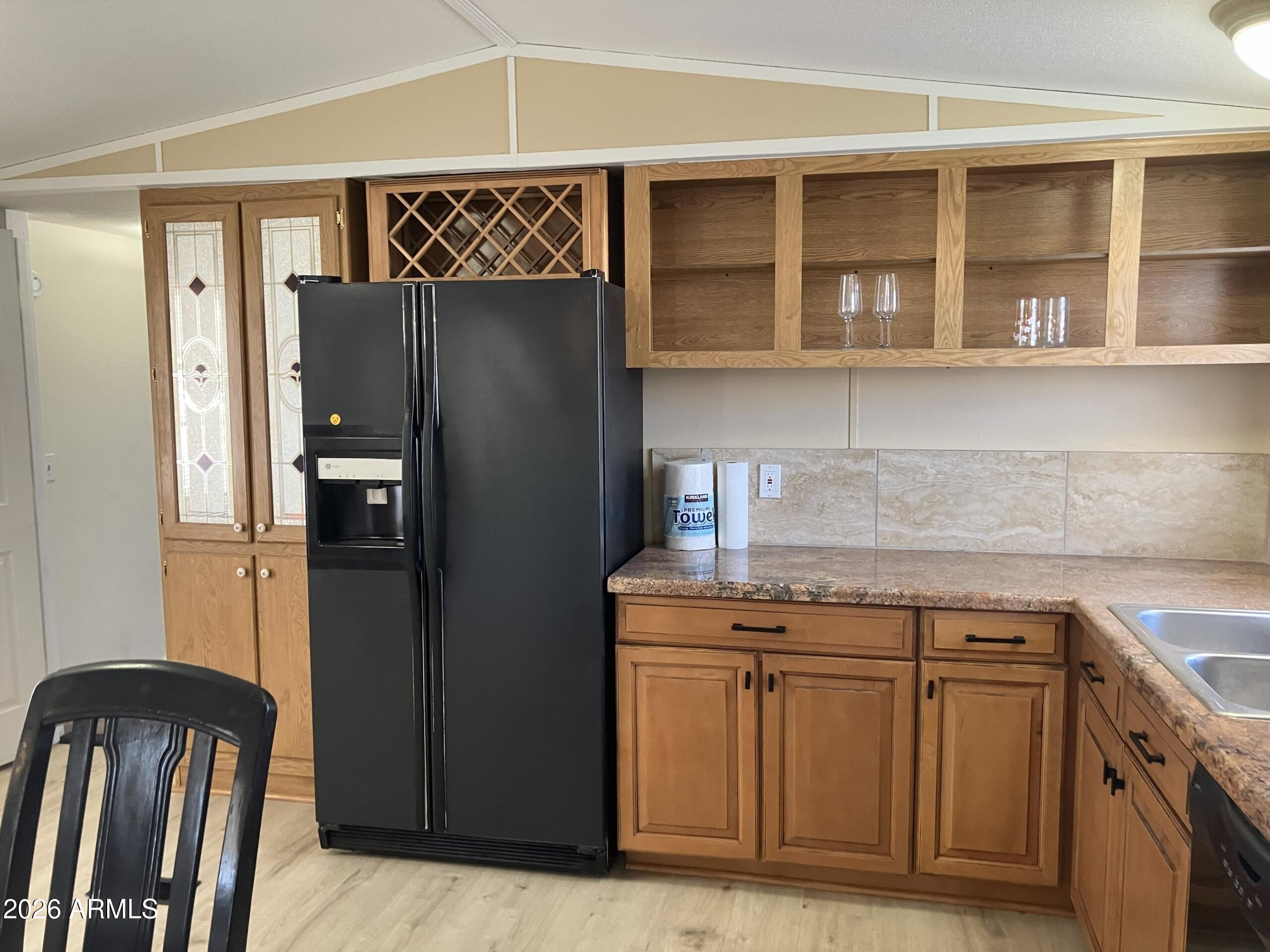2523 East Contention Mine Road, Unit 41 Phoenix, AZ 85032 - Photo 11 of 19 a kitchen with stainless steel appliances granite countertop a refrigerator and a sink