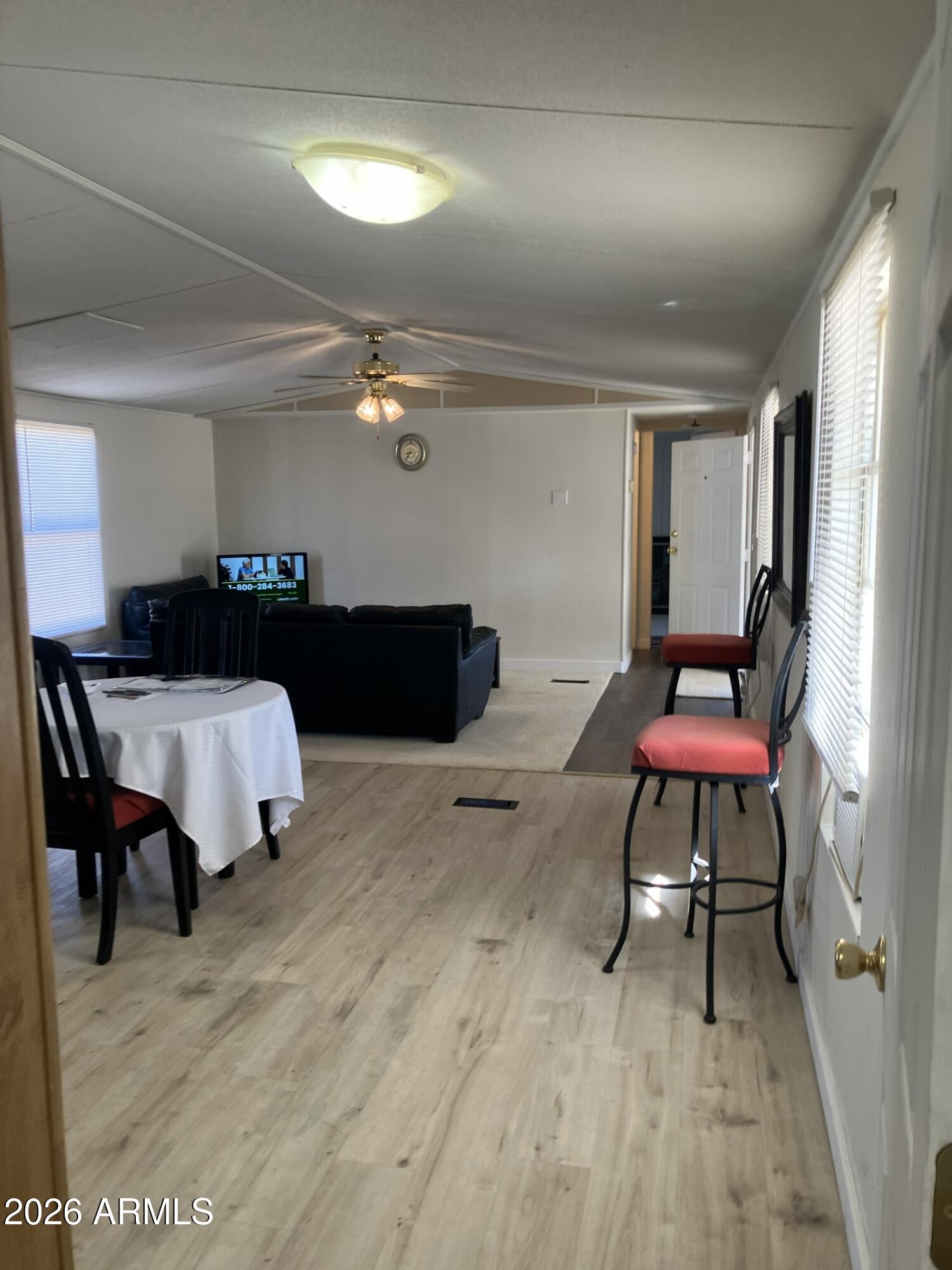 2523 East Contention Mine Road, Unit 41 Phoenix, AZ 85032 - Photo 12 of 19 a living room with furniture and a rug