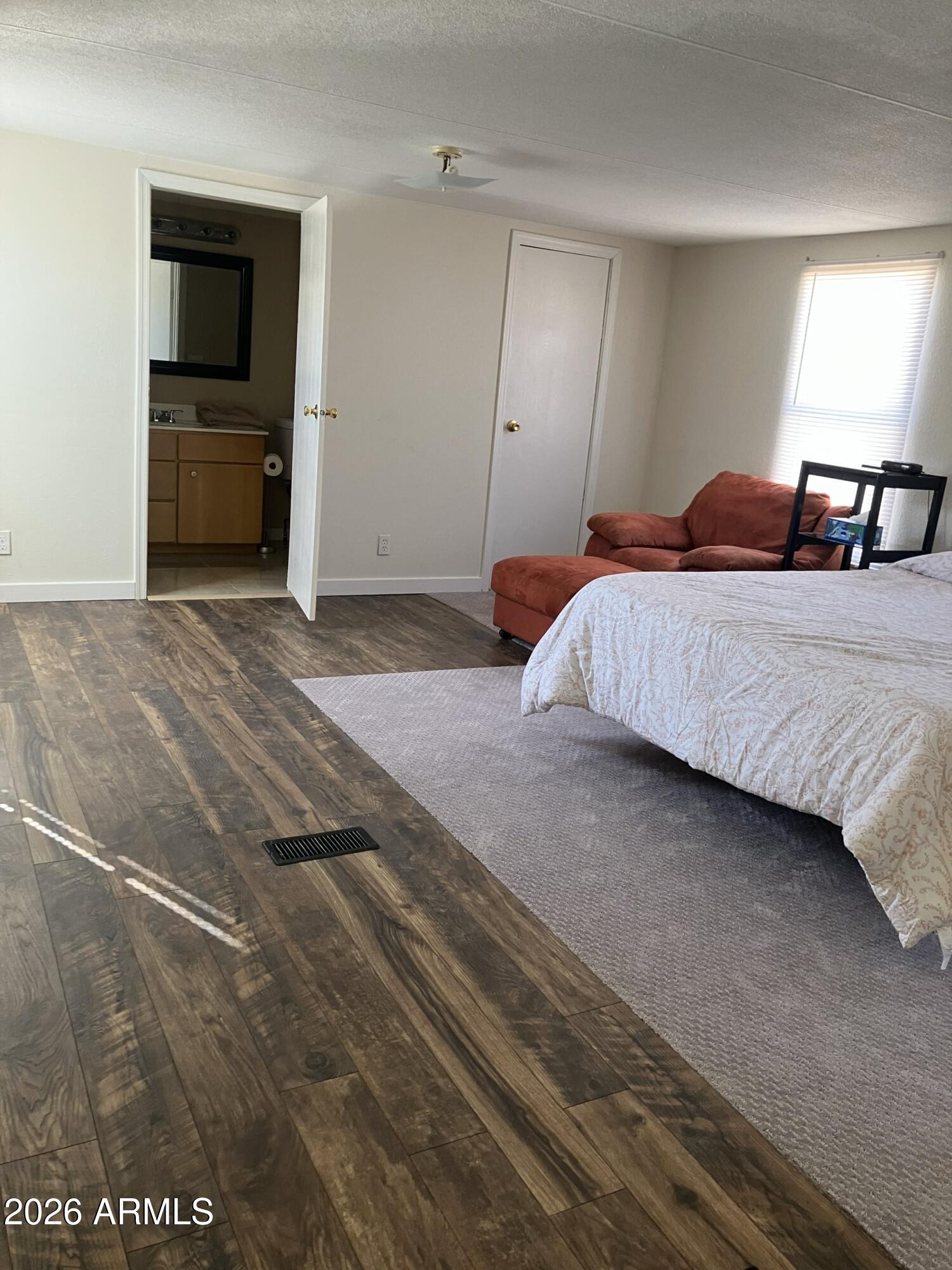 2523 East Contention Mine Road, Unit 41 Phoenix, AZ 85032 - Photo 13 of 19 a bedroom with a bed and a view of kitchen
