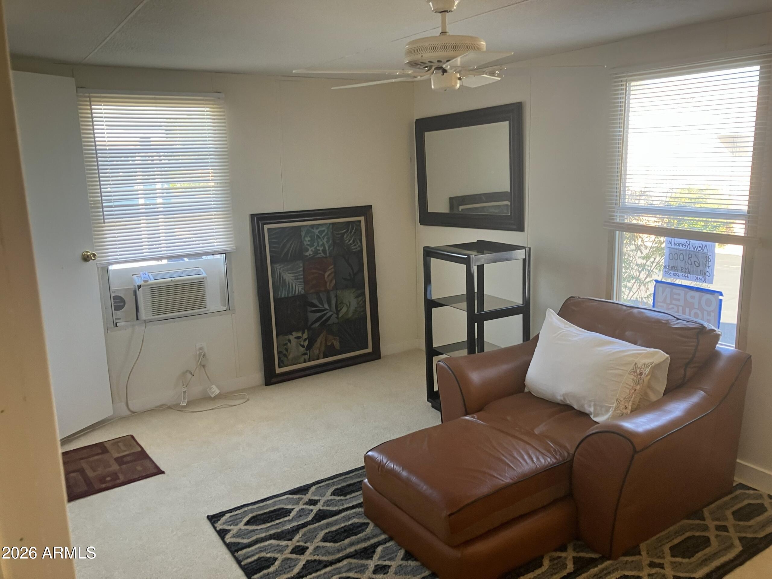 2523 East Contention Mine Road, Unit 41 Phoenix, AZ 85032 - Photo 16 of 19 a living room with furniture and a window