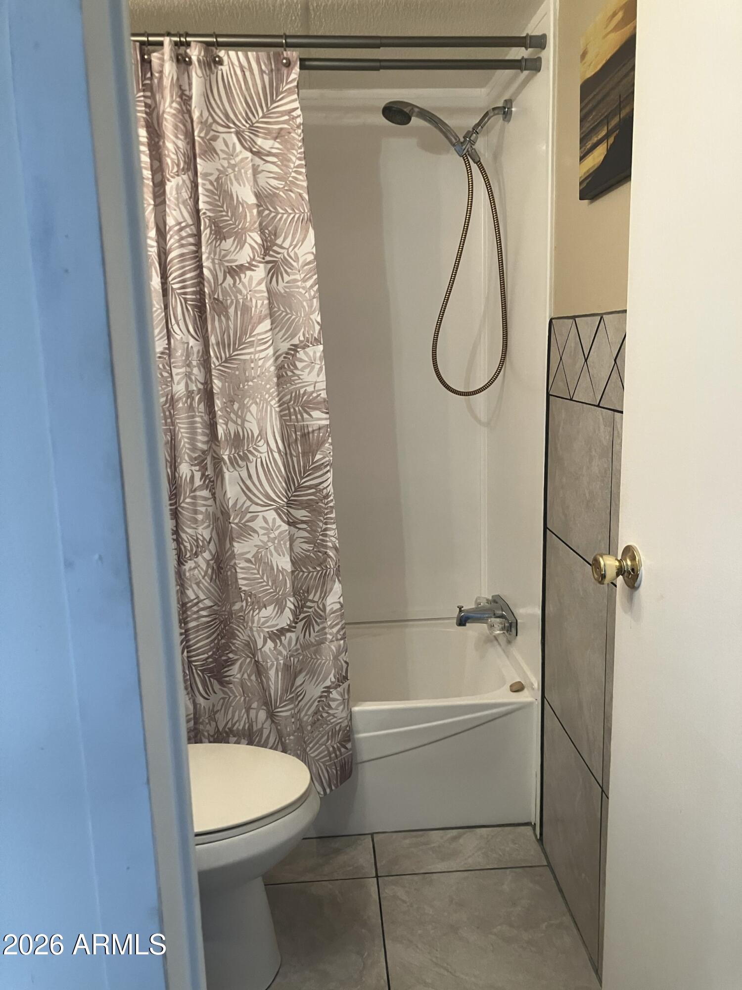 2523 East Contention Mine Road, Unit 41 Phoenix, AZ 85032 - Photo 18 of 19 a bathroom with a granite countertop bathtub shower and a toilet