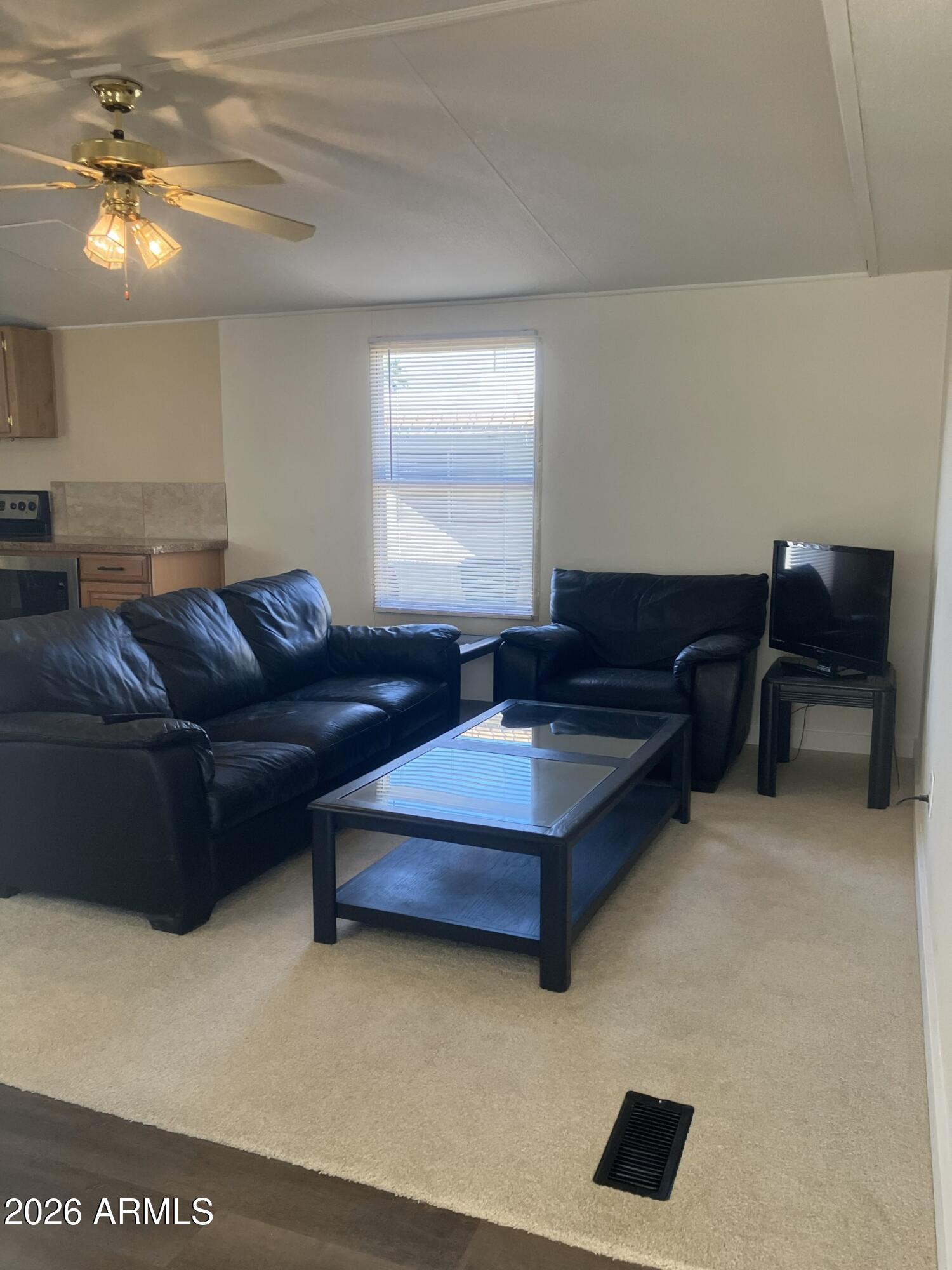 2523 East Contention Mine Road, Unit 41 Phoenix, AZ 85032 - Photo 6 of 19 a living room with furniture and a lamp