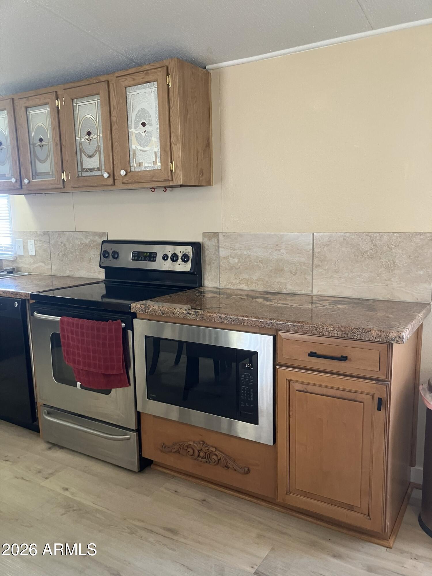 2523 East Contention Mine Road, Unit 41 Phoenix, AZ 85032 - Photo 9 of 19 a stove top oven sitting inside of a kitchen