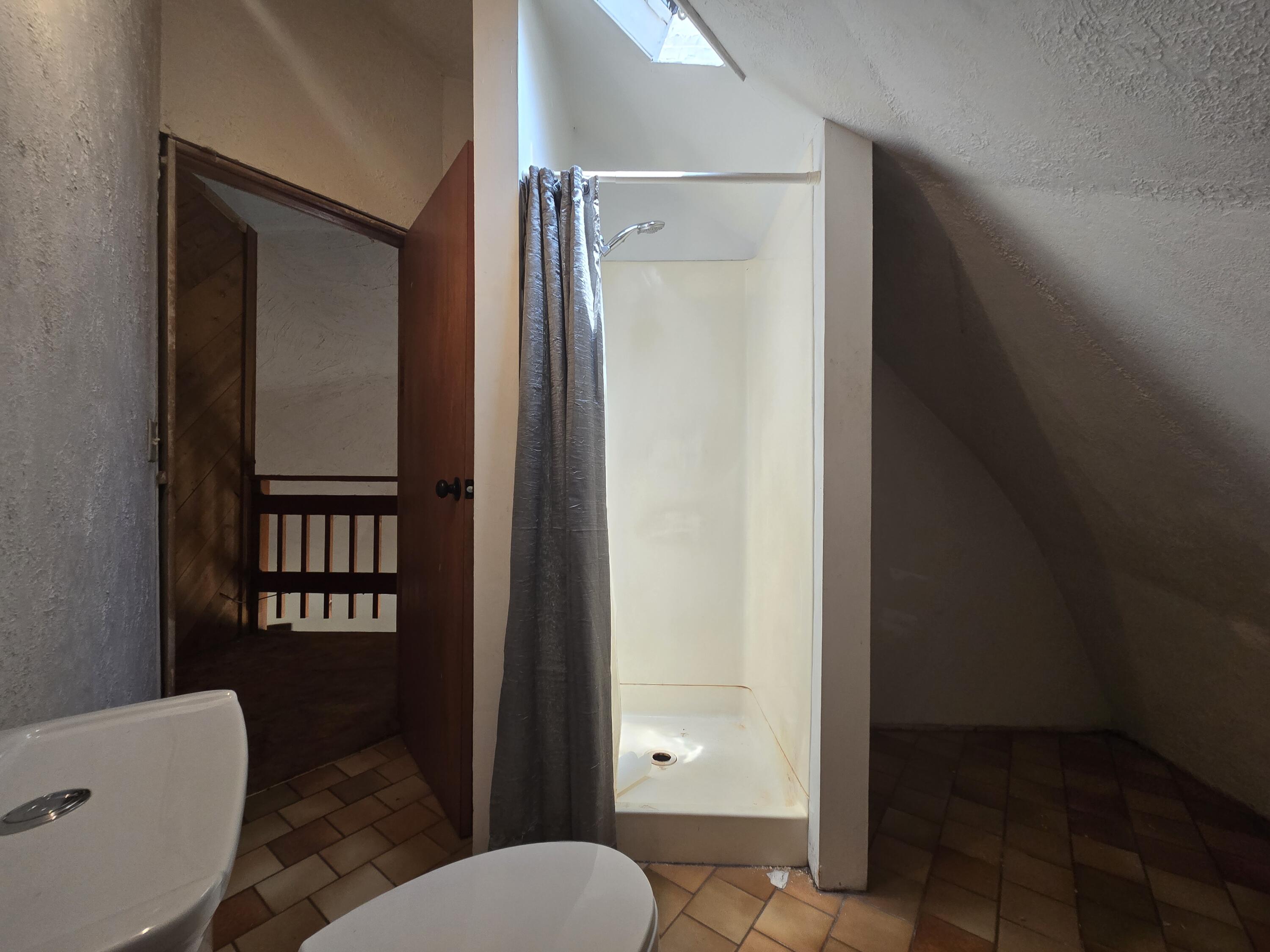 18353 Old Oasis Road Redding, CA 96003 - Photo 16 of 22 a bathroom with a toilet and a shower