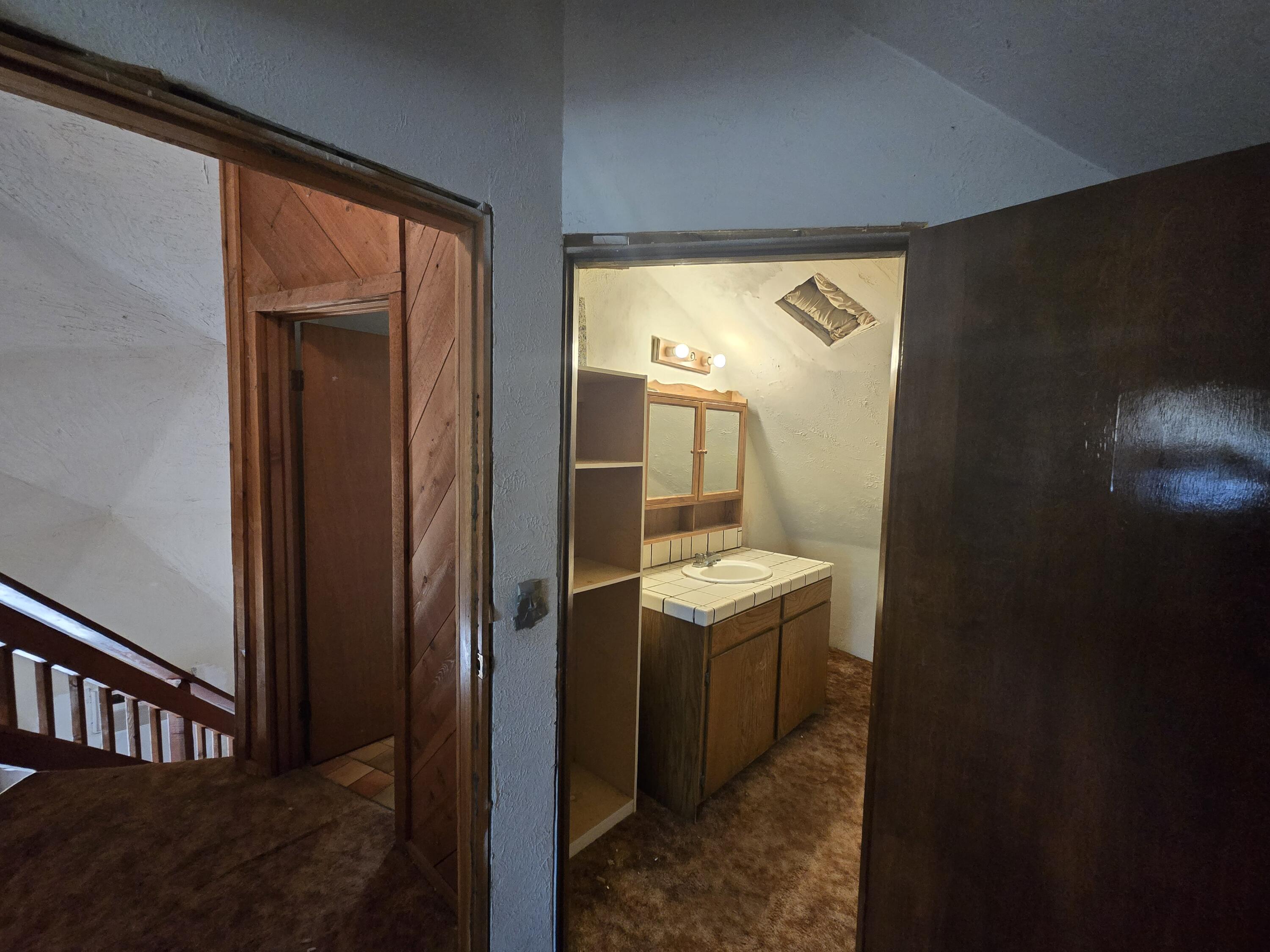 18353 Old Oasis Road Redding, CA 96003 - Photo 17 of 22 a bathroom with a sink a mirror and a toilet