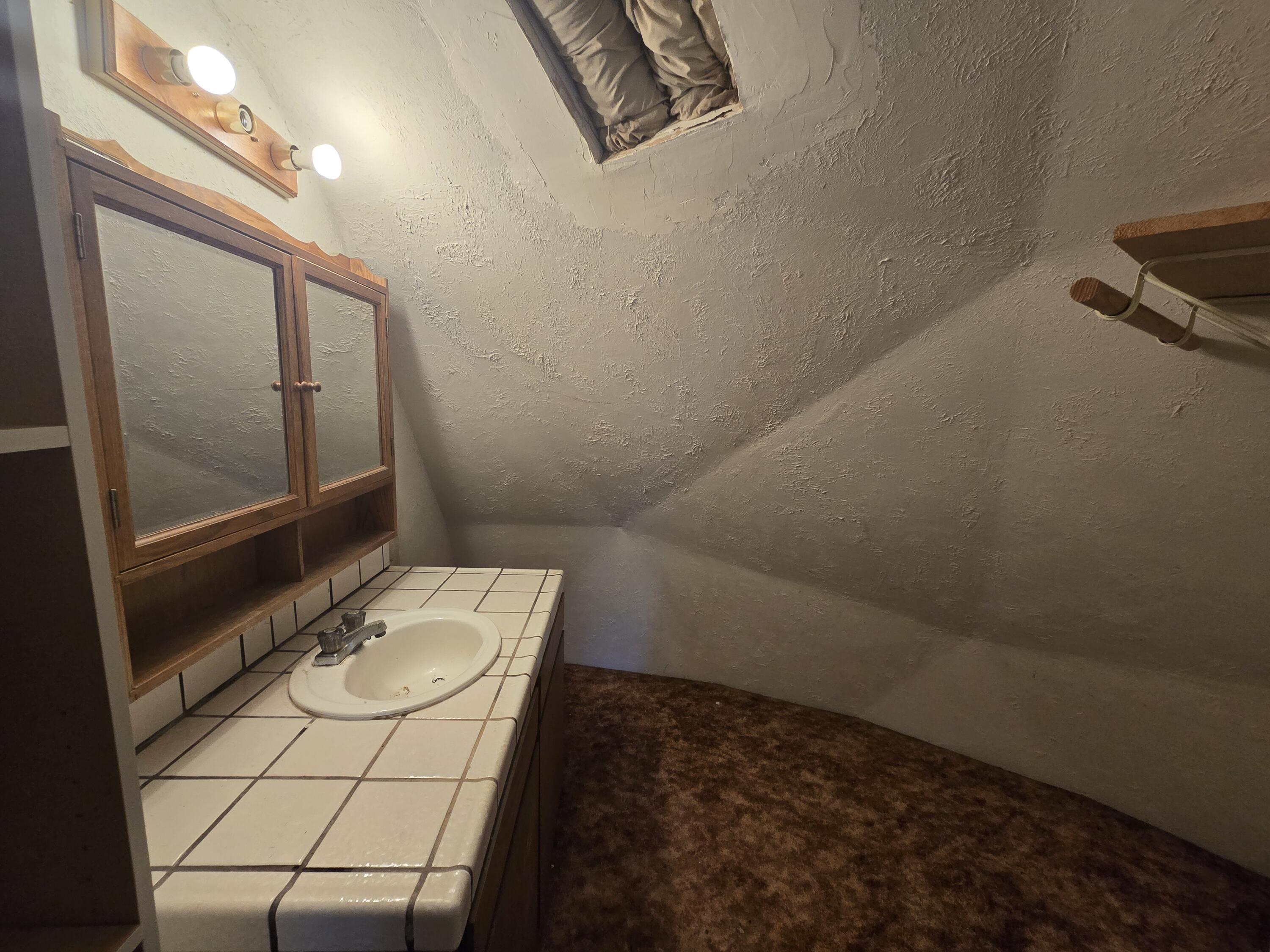 18353 Old Oasis Road Redding, CA 96003 - Photo 18 of 22 a bathroom with a sink toilet and mirror