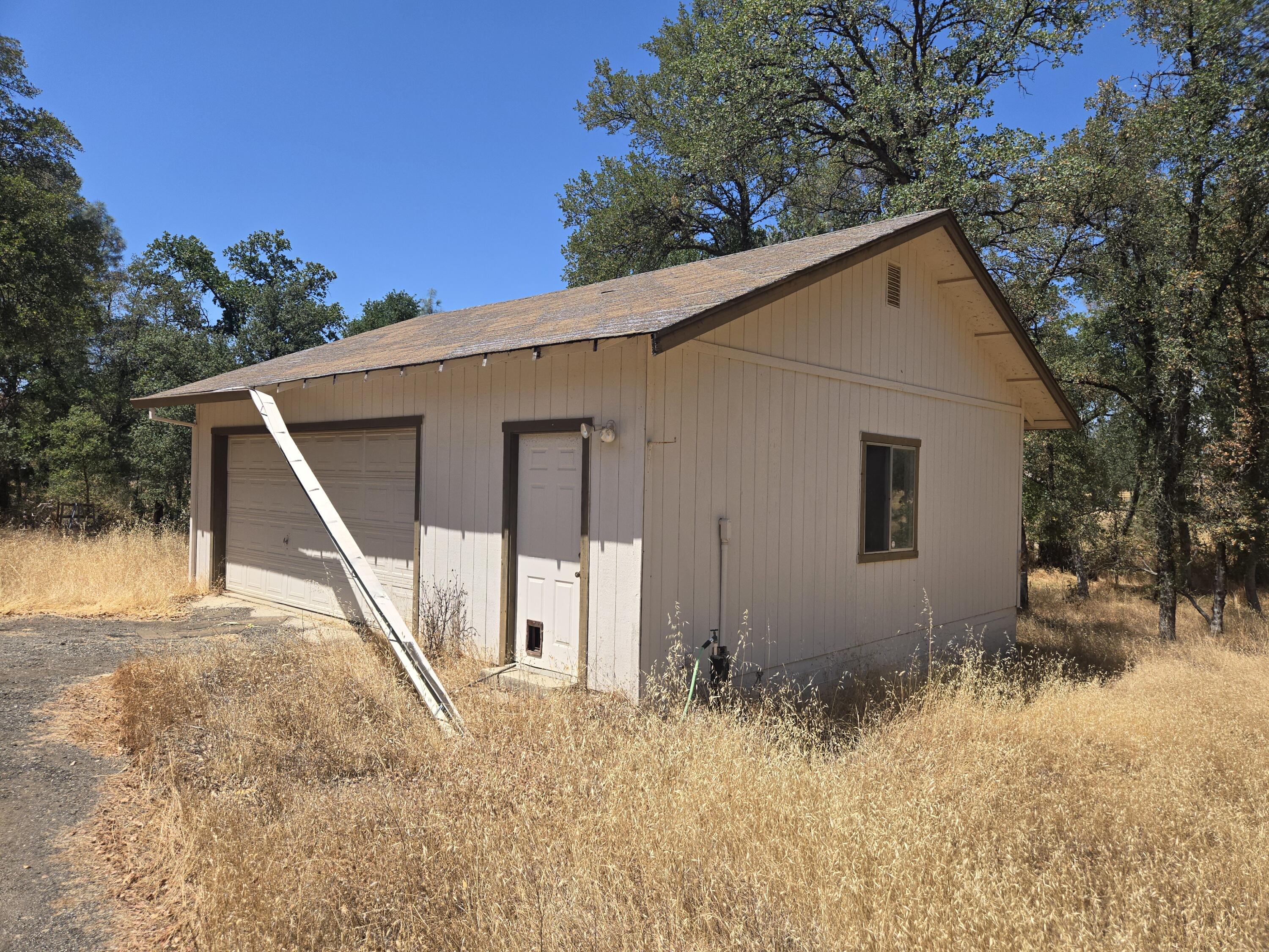18353 Old Oasis Road Redding, CA 96003 - Photo 20 of 22 a view of a house with a yard