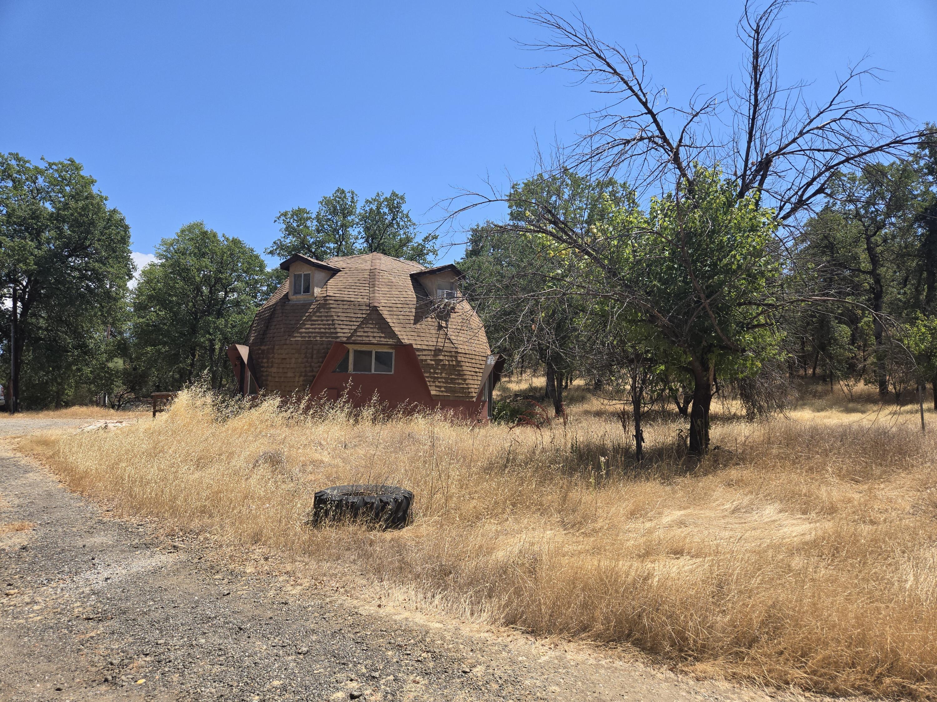 18353 Old Oasis Road Redding, CA 96003 - Photo 2 of 22 a view of a yard with wooden fence