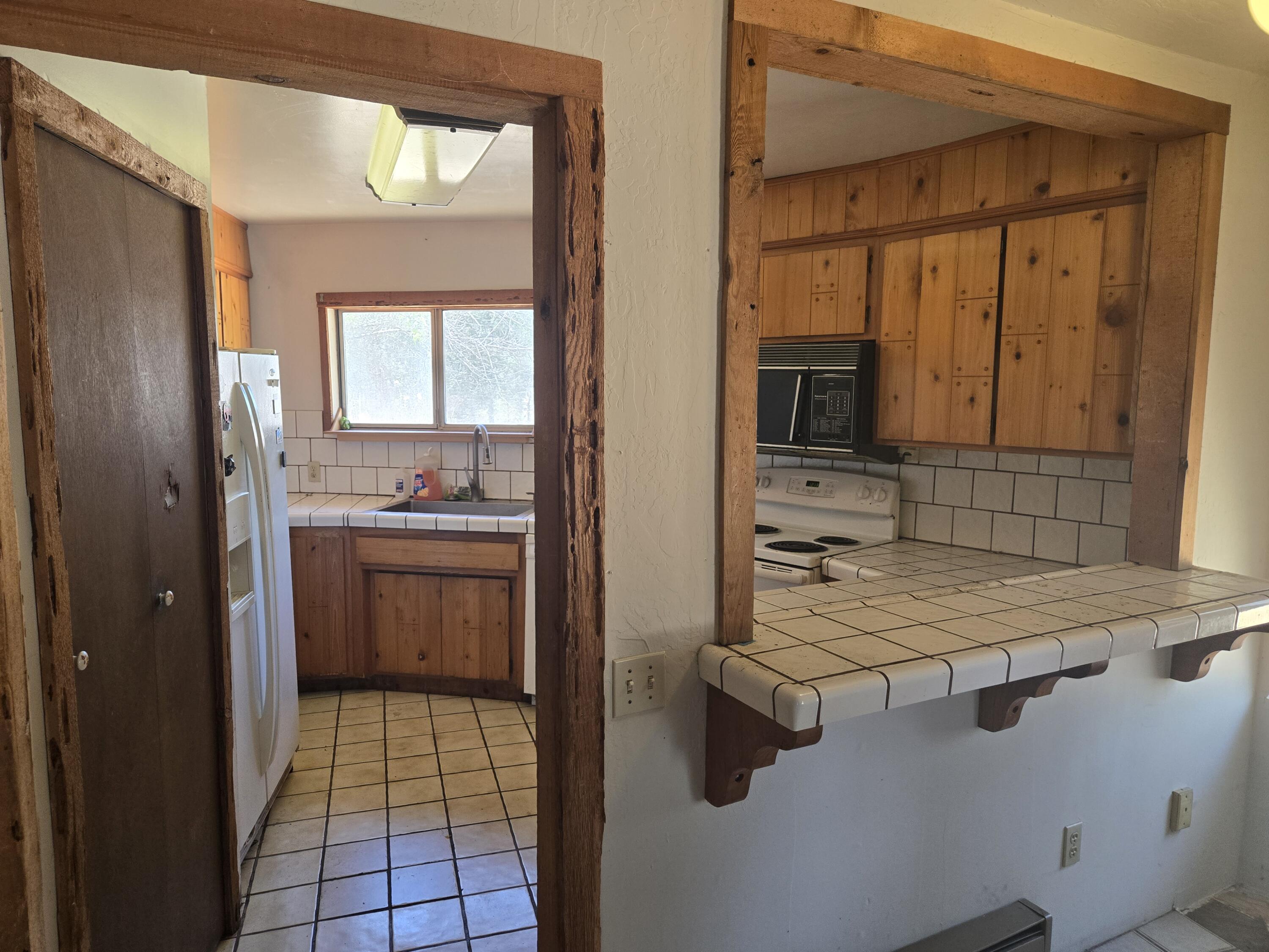 18353 Old Oasis Road Redding, CA 96003 - Photo 8 of 22 a bathroom with a shower a sink and a mirror