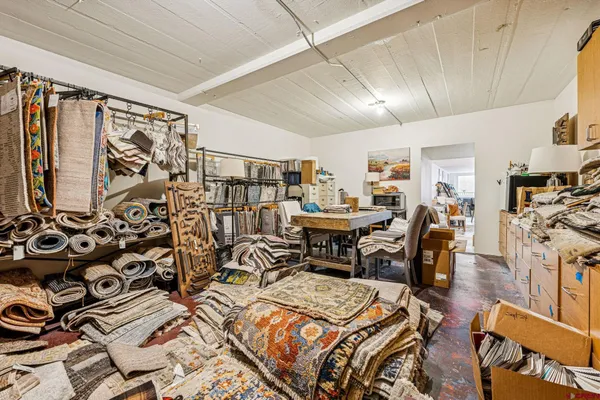a view of a livingroom with furniture and a rug