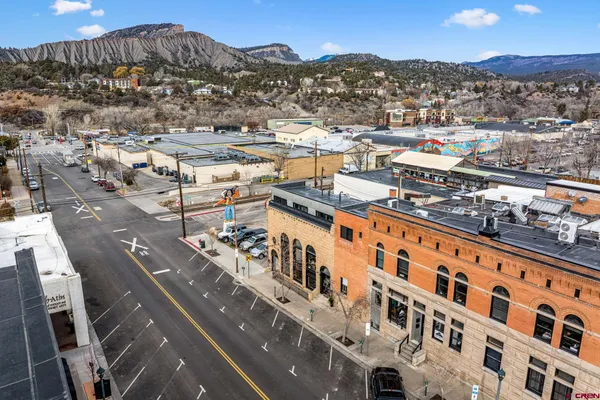an aerial view of a large building with an outdoor space