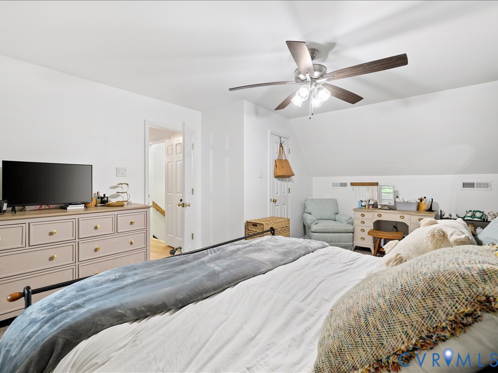 6806 Full Rack Circle Midlothian, VA 23112 - Photo 22 of 29 a bedroom with a bed and a flat screen tv