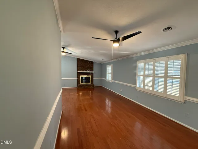 a view of a patio with a table and chairs