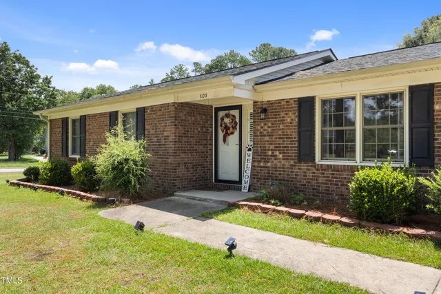 a view of a table and chairs in the garden