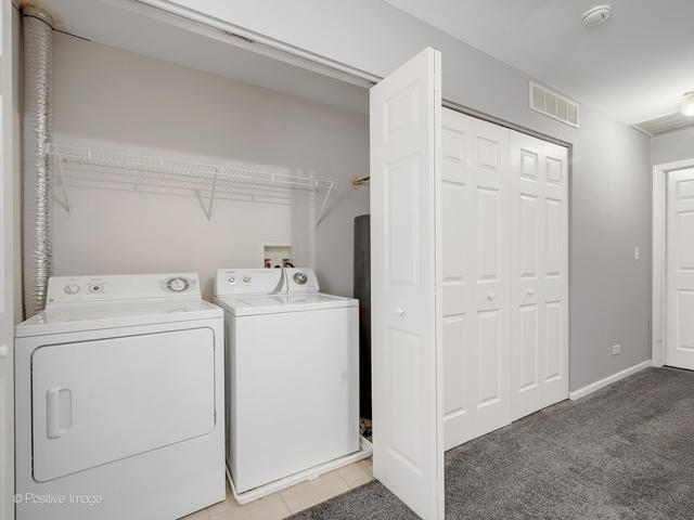 835 Genesee Drive Naperville, IL 60563 - Photo 12 of 18 a view of storage and utility room with washer and dryer