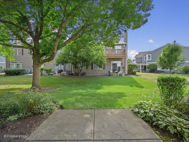 835 Genesee Drive Naperville, IL 60563 - Photo 15 of 18 a view of a house with a yard
