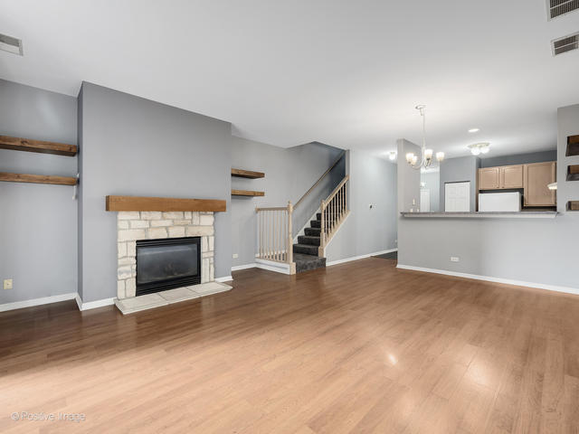 835 Genesee Drive Naperville, IL 60563 - Photo 2 of 18 a view of a kitchen with a sink and a fireplace