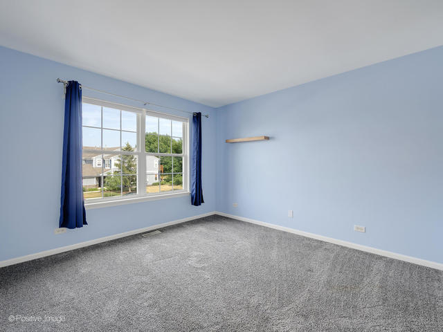 835 Genesee Drive Naperville, IL 60563 - Photo 10 of 18 a view of an empty room with a window