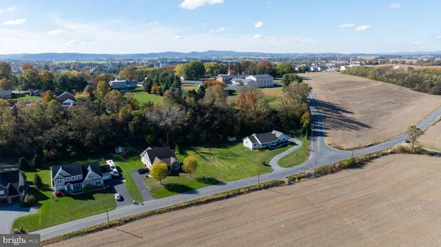 an aerial view of a house with a garden