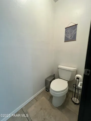 a bedroom with a bed and a desk