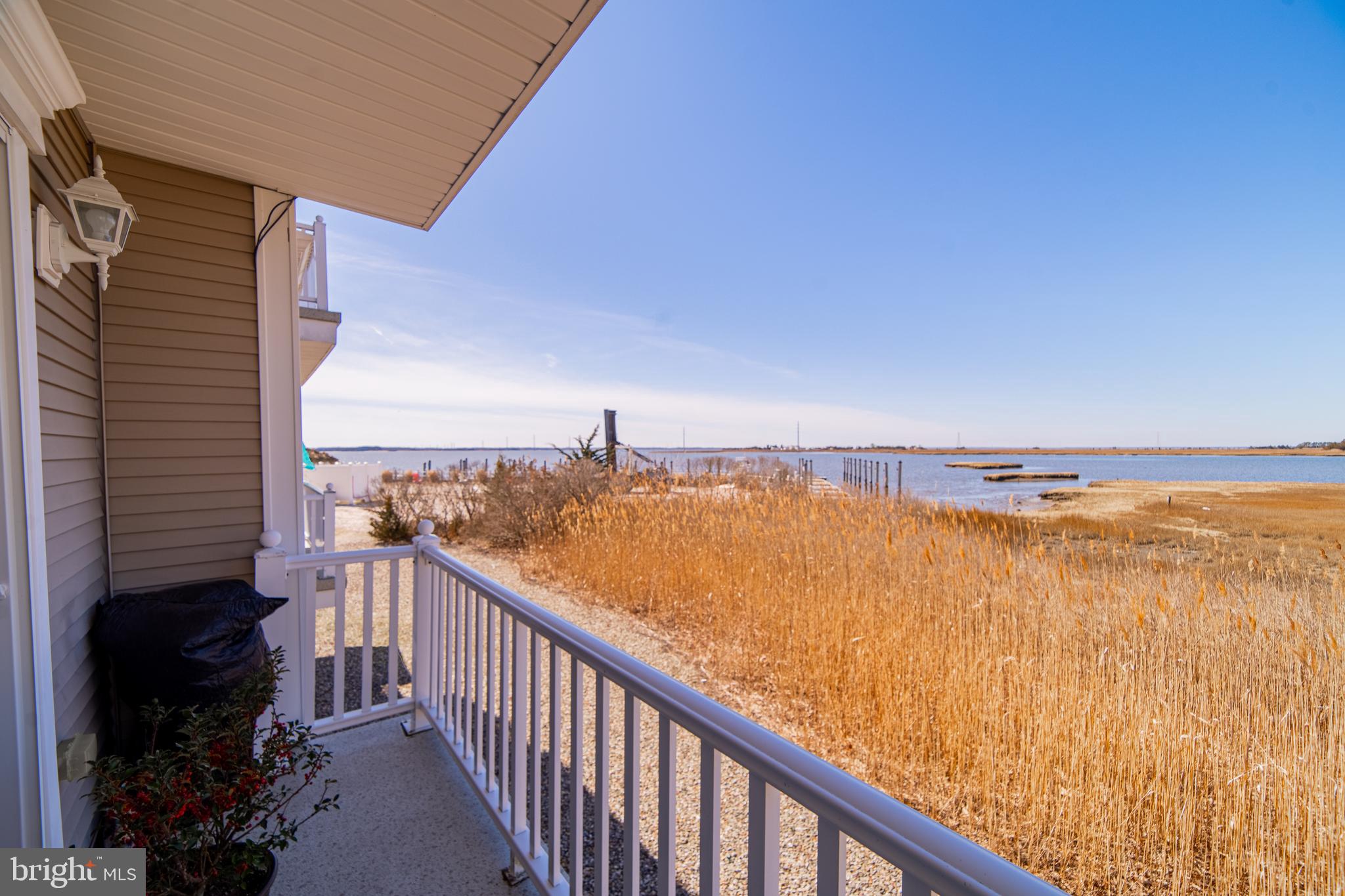 61 Dockside Drive Somers Point, NJ 08244 - Photo 18 of 23 a view of a balcony with ocean view