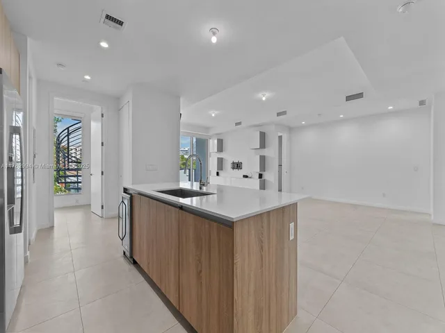 a view of a kitchen with washer and dryer