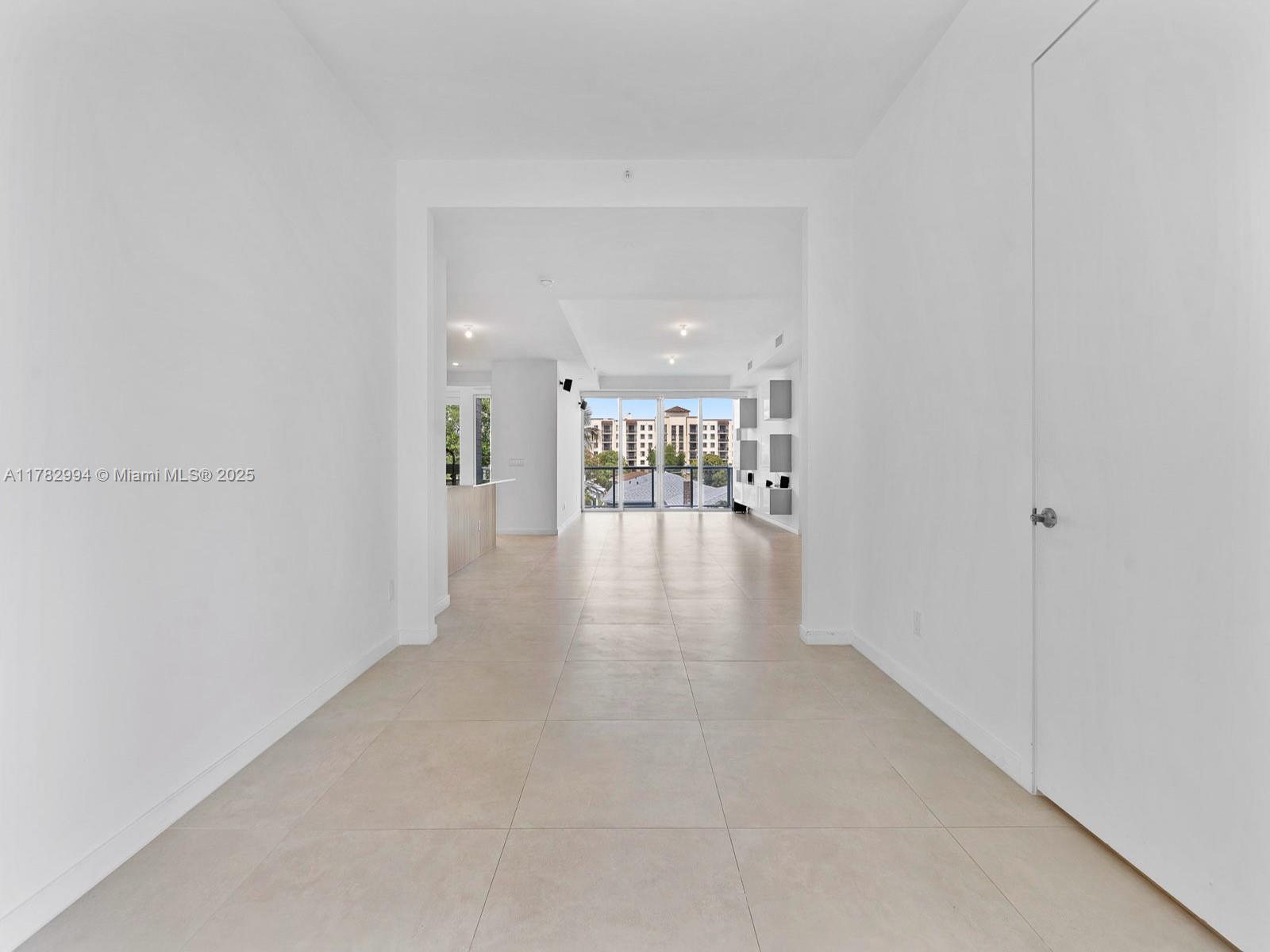529 Southwest 11th Street, Unit 303 Miami, FL 33129 - Photo 2 of 64 a view of a hallway with wooden floor