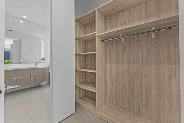 a bathroom with a double vanity sink and mirror