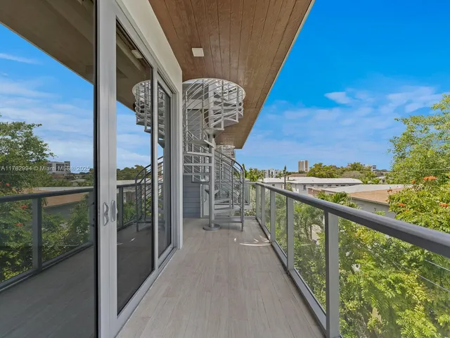 a view of a kitchen with a sink and a microwave