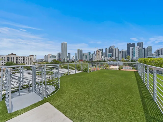 a view of a balcony with two chairs