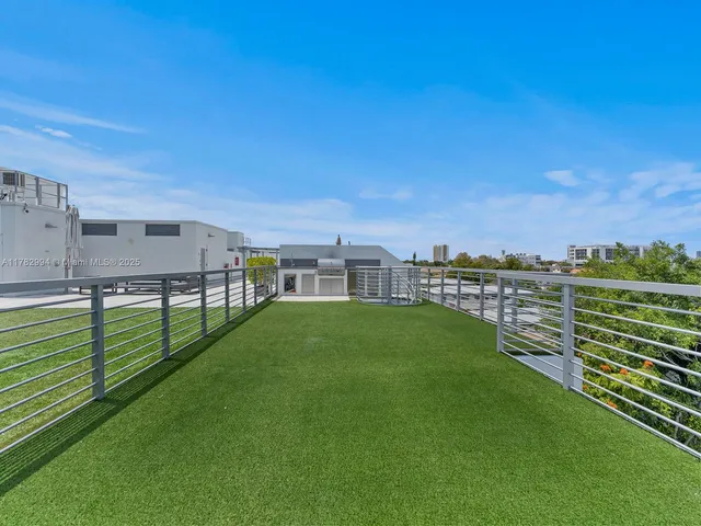 a kitchen with cabinets and window