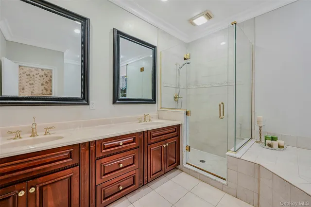 a spacious bathroom with a double vanity sink mirror and double