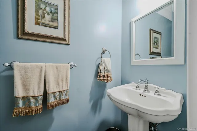 a bathroom with a sink and mirror