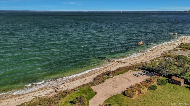 a view of a yard with an ocean view