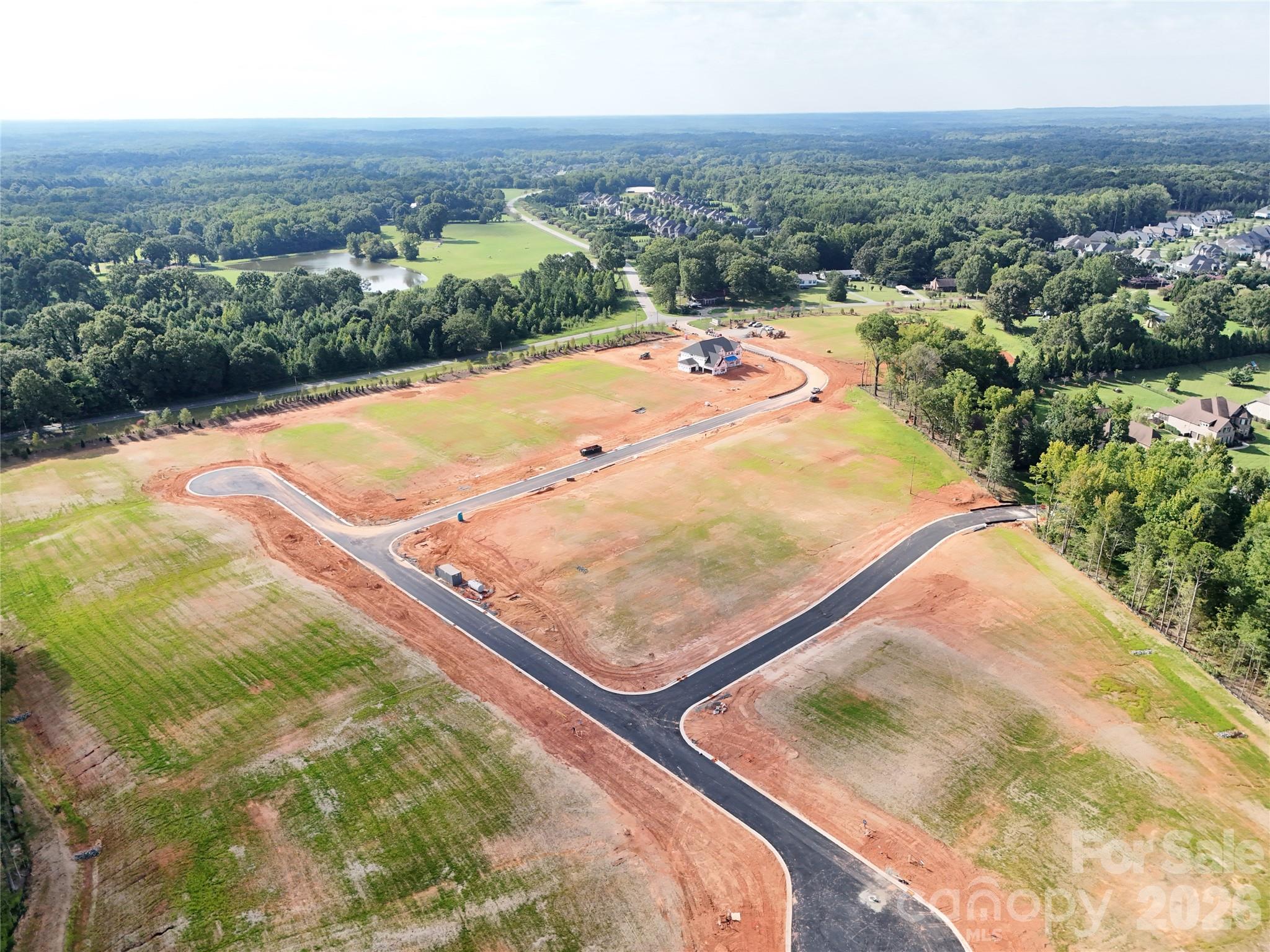 1028 Cox Road, Unit 11 Weddington, NC 28104 - Photo 2 of 3 an aerial view of residential houses with outdoor space