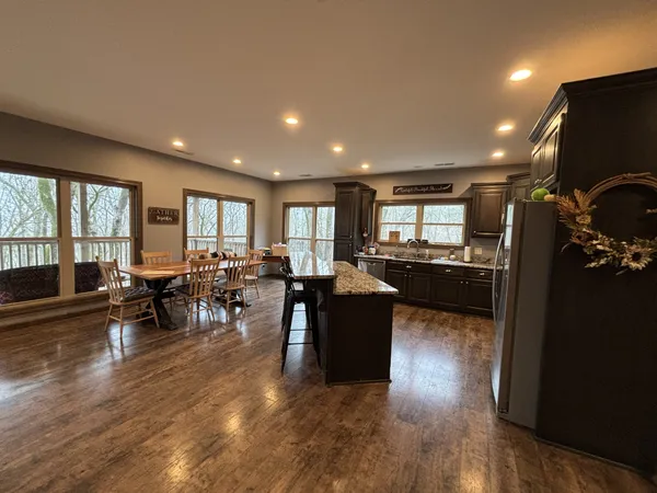 a bed sitting in a bedroom next to a window with a chandelier