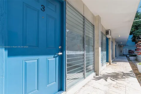 a view of a door and an chairs in the house