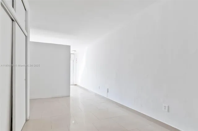 a kitchen with white cabinets