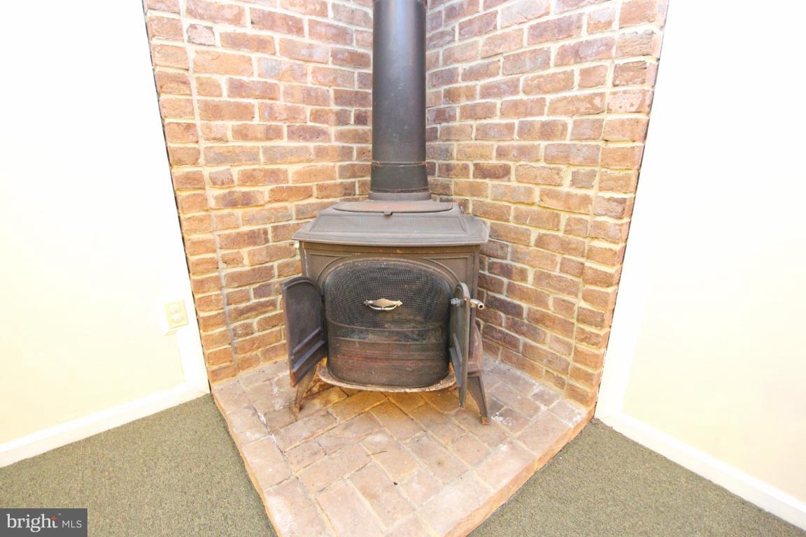 405 Calvary Road Churchville, MD 21028 - Photo 23 of 29 wood stove in basement
