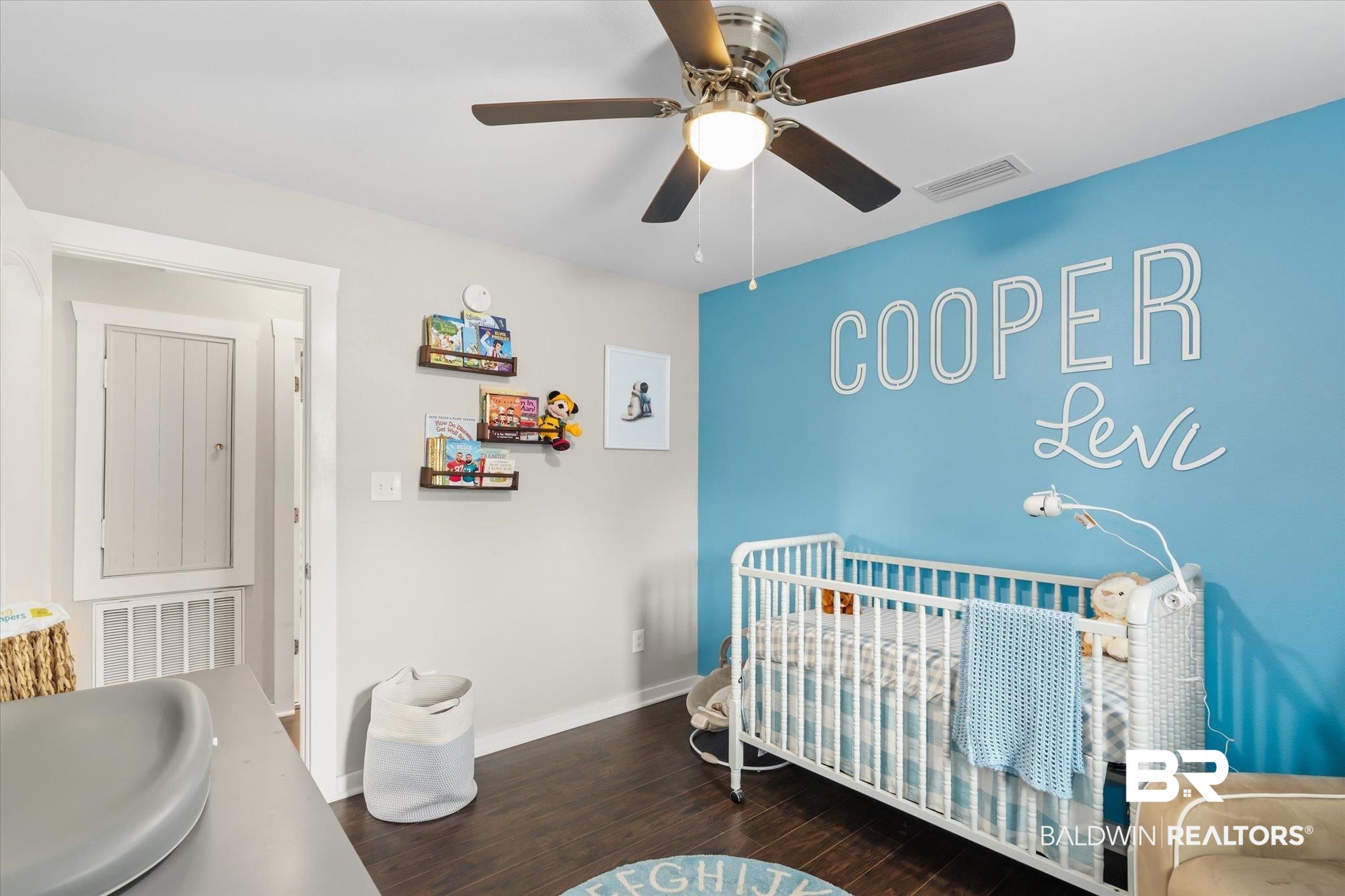 419 Pierce Street Saraland, AL 36571 - Photo 15 of 21 Bedroom with a crib, dark hardwood / wood-style flooring, sink, and ceiling fan