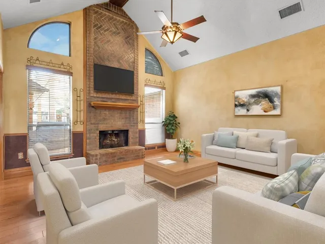 a large kitchen with granite countertop a sink and cabinets