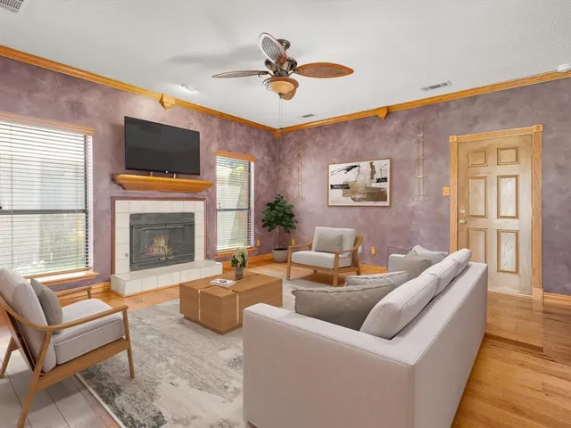 a spacious bedroom with a bed and a potted plant