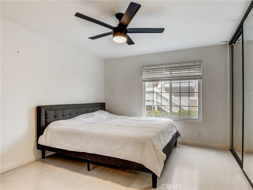 98 Greenfield, Unit 95 Irvine, CA 92614 - Photo 19 of 48 a bed sitting in a bedroom next to a window