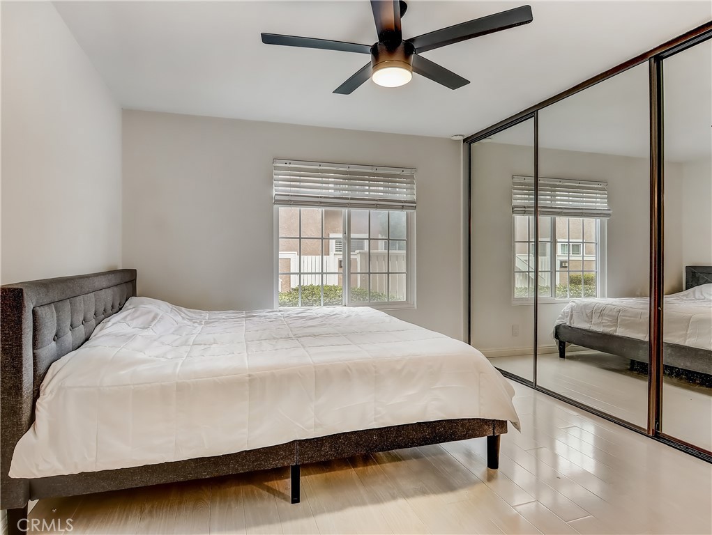 98 Greenfield, Unit 95 Irvine, CA 92614 - Photo 22 of 48 a large bed sitting in a bedroom next to a window