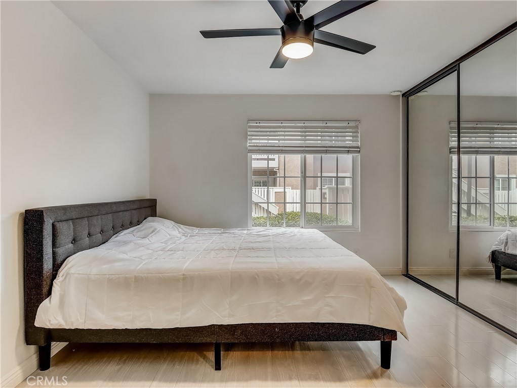 98 Greenfield, Unit 95 Irvine, CA 92614 - Photo 23 of 48 a large bed sitting in a bedroom next to a window