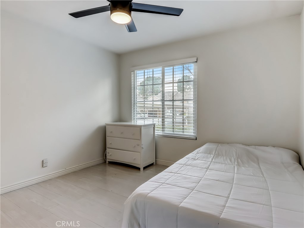 98 Greenfield, Unit 95 Irvine, CA 92614 - Photo 30 of 48 a bedroom with a bed and window