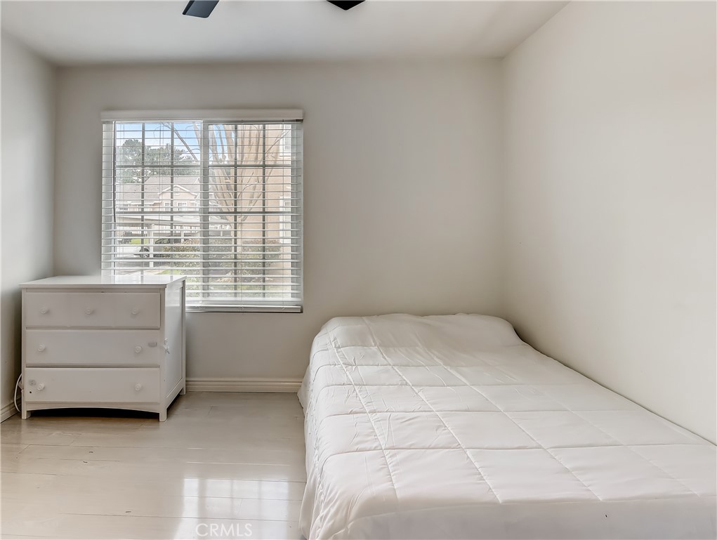 98 Greenfield, Unit 95 Irvine, CA 92614 - Photo 32 of 48 a room with a bed and a window