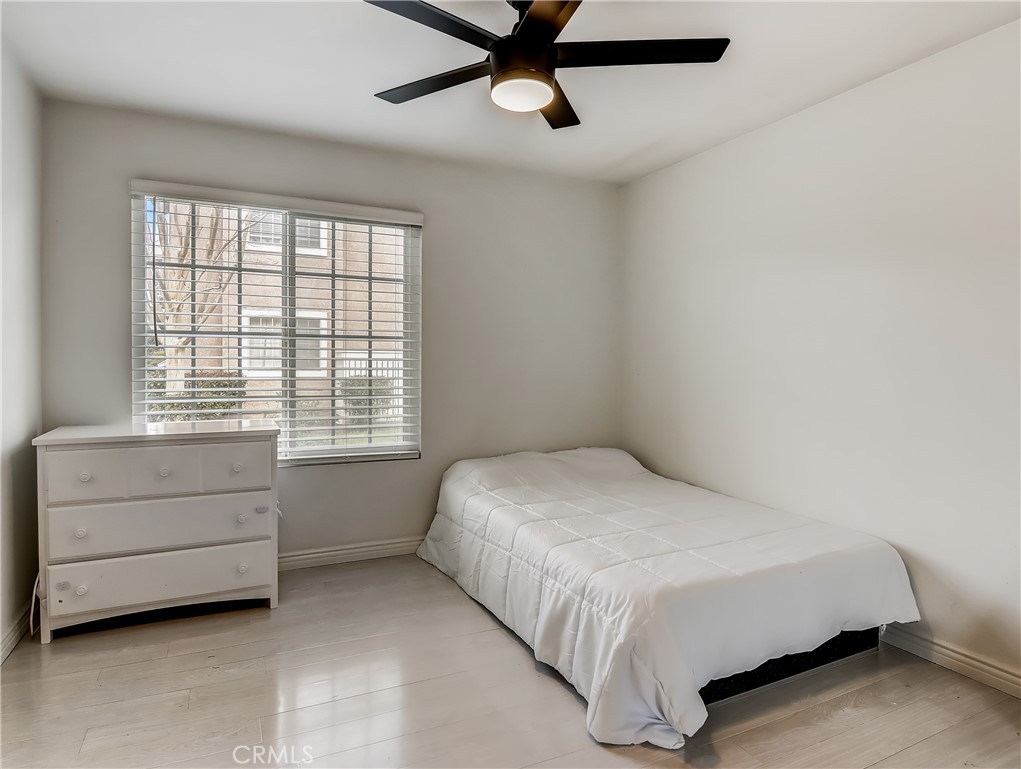 98 Greenfield, Unit 95 Irvine, CA 92614 - Photo 33 of 48 a bedroom with a bed and a window