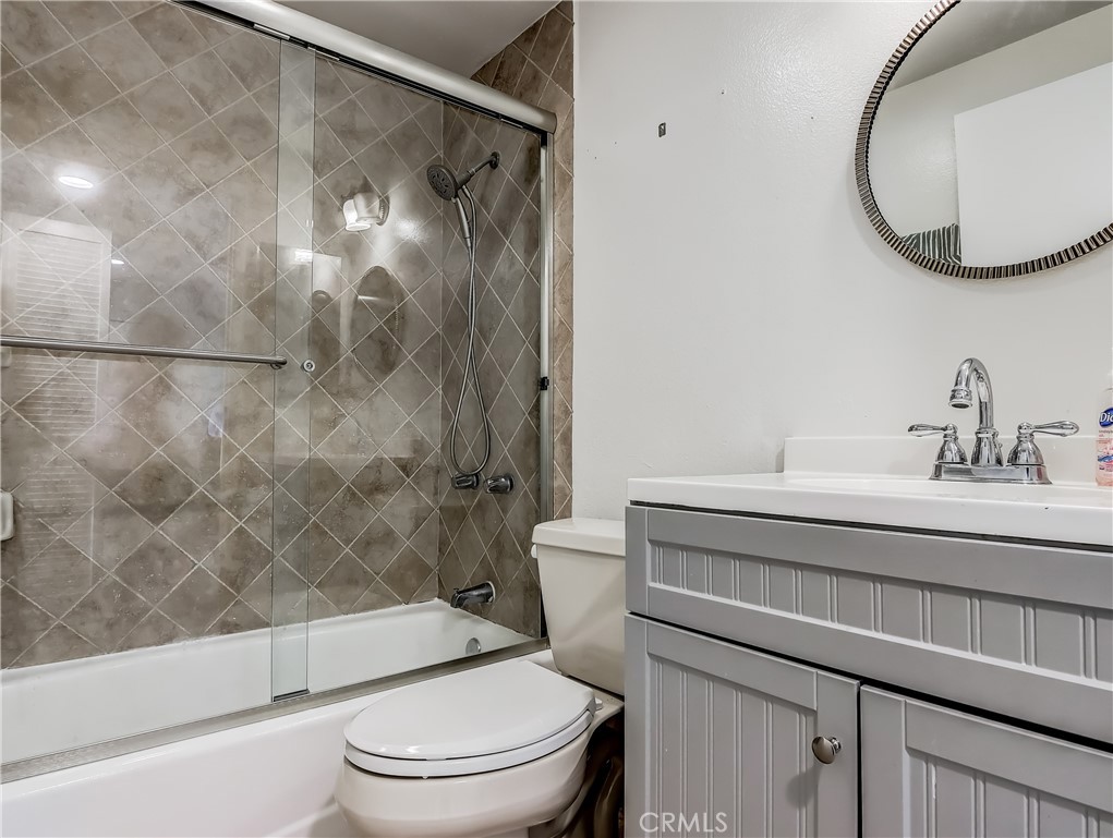 98 Greenfield, Unit 95 Irvine, CA 92614 - Photo 34 of 48 a bathroom with a sink a toilet and a mirror