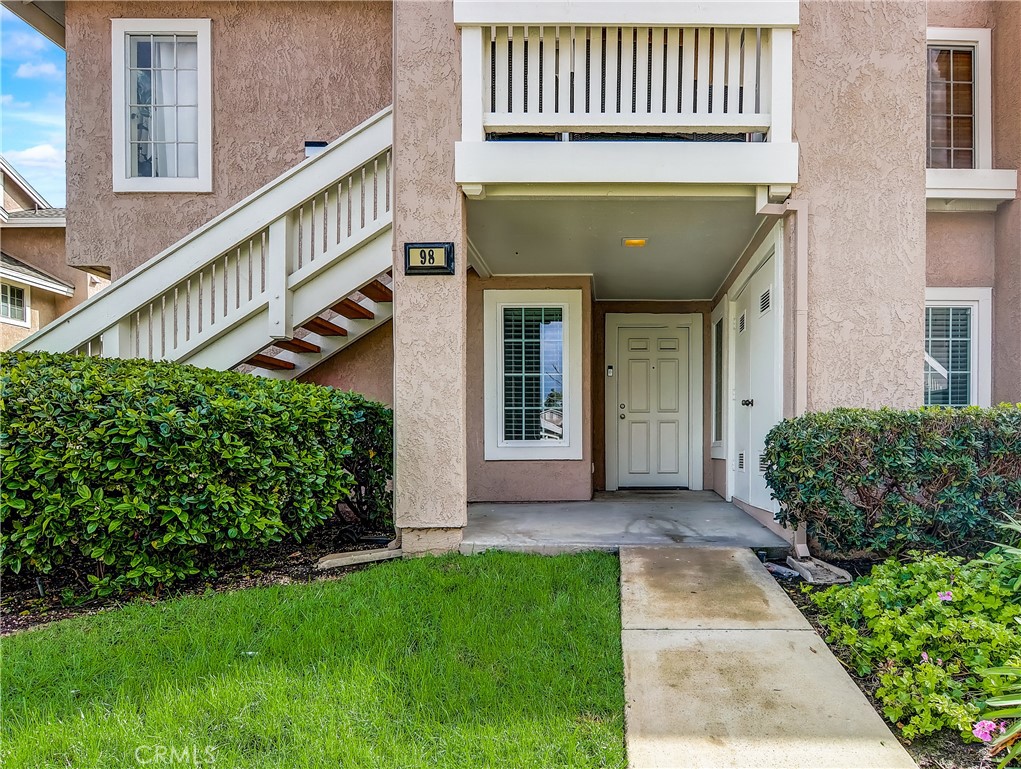 98 Greenfield, Unit 95 Irvine, CA 92614 - Photo 36 of 48 a front view of a house with a garden